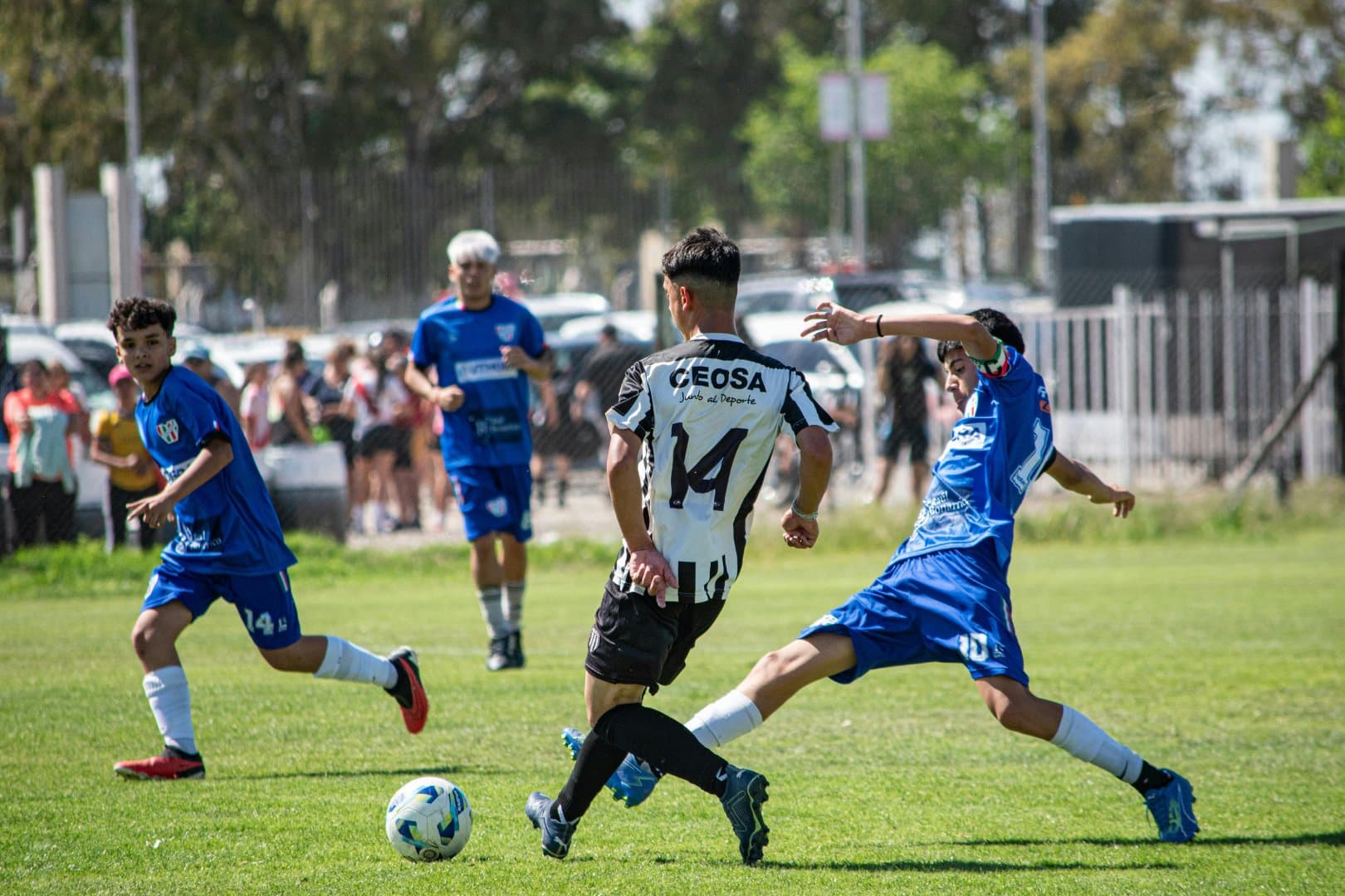 Soccer players battling for the ball during a match